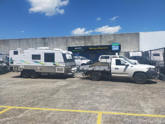 Caravan being collected from yard